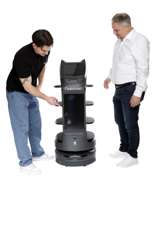 Der RoboPlanet Servicetechniker zeigt dem Kunden den Werbescreen auf dem Serviceroboter BellaBot Pro der Marke Pudu